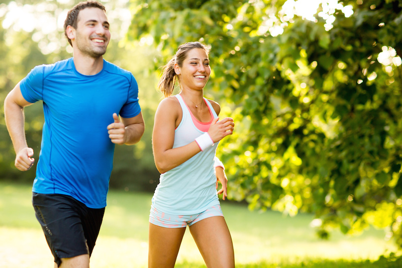 young couple running outdoors
