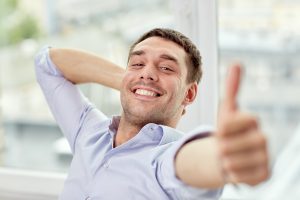 smiling man with thumbs up