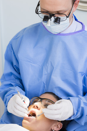 Dentist examining patients mouth
